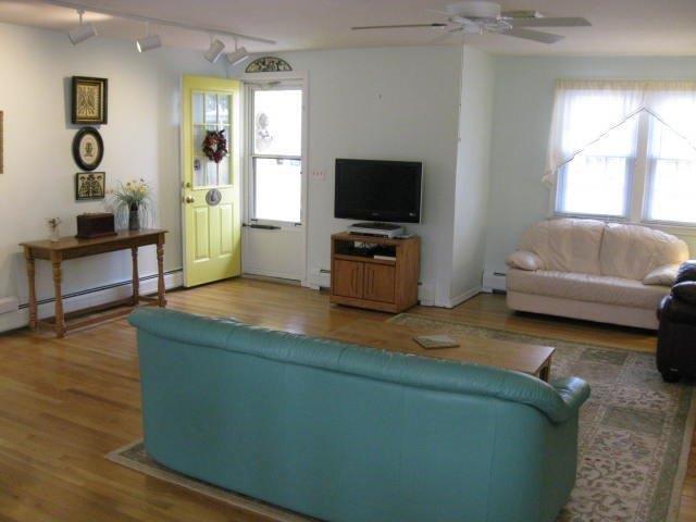 64 Ansel Howland Road Centerville, MA 02632 - Photo 5 of 31 a living room with furniture and a flat screen tv