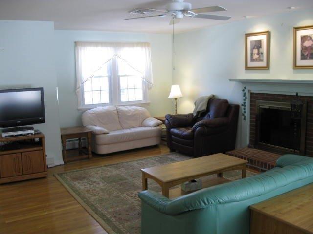 64 Ansel Howland Road Centerville, MA 02632 - Photo 6 of 31 a living room with furniture and a flat screen tv