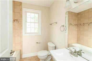 700 Midland Road Silver Spring, MD 20904 - Photo 12 of 17 a bathroom with a granite countertop sink toilet and shower
