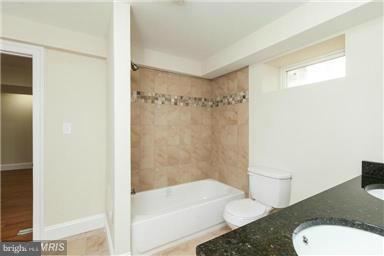 700 Midland Road Silver Spring, MD 20904 - Photo 13 of 17 a bathroom with a sink and a mirror