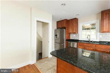 700 Midland Road Silver Spring, MD 20904 - Photo 14 of 17 a kitchen with stainless steel appliances granite countertop a refrigerator and a sink