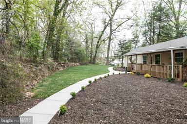 700 Midland Road Silver Spring, MD 20904 - Photo 5 of 17 a view of a house with backyard and garden