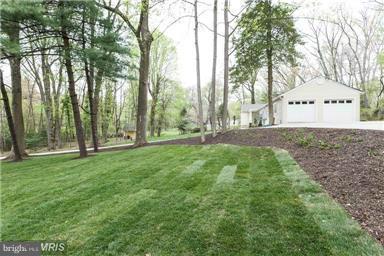 700 Midland Road Silver Spring, MD 20904 - Photo 9 of 17 a backyard of a house with table and chairs