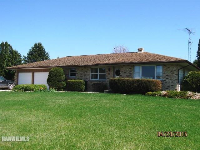 795 North Mammoser Road Stockton, IL 61085 - Photo 1 of 16 a front view of a house with a garden