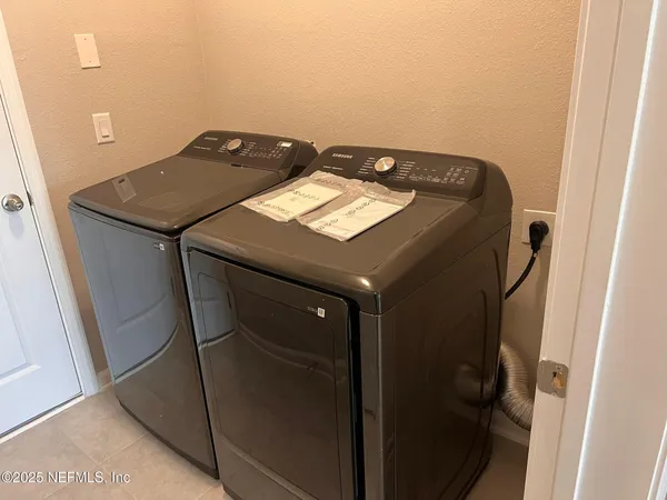 a utility room with dryer and washer