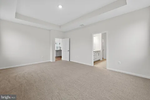 a view of empty room with windows