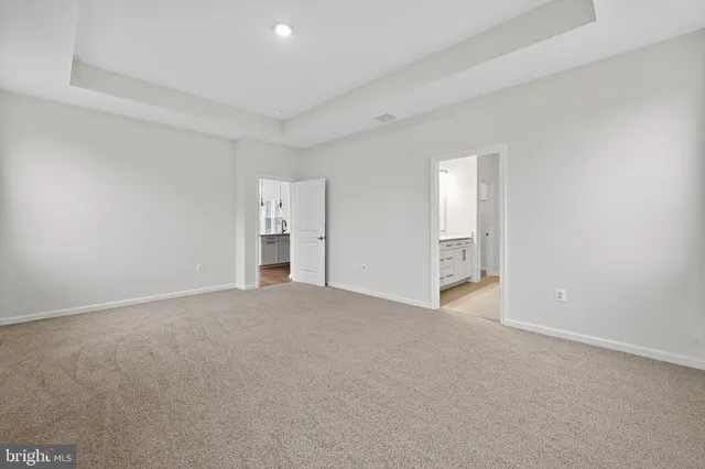 a view of empty room with windows