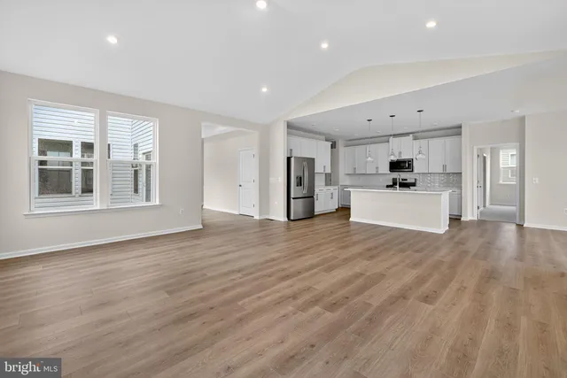 a view of a kitchen with a stove cabinets and wooden floor