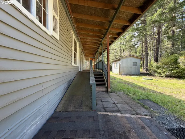 a view of a balcony with wooden floor