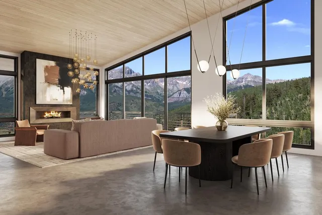 a view of a dining room with furniture large windows and wooden floor
