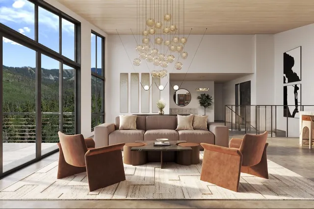 a living room with furniture and a chandelier