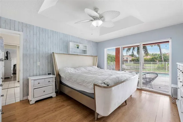 a bedroom with a large bed and a large window