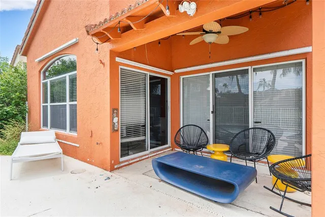 a front view of a house with outdoor seating