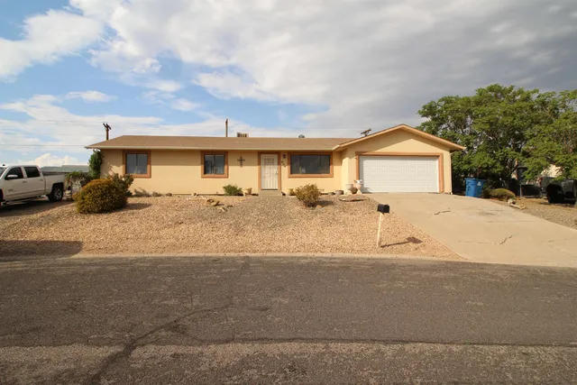 a view of a house with a snow on the road