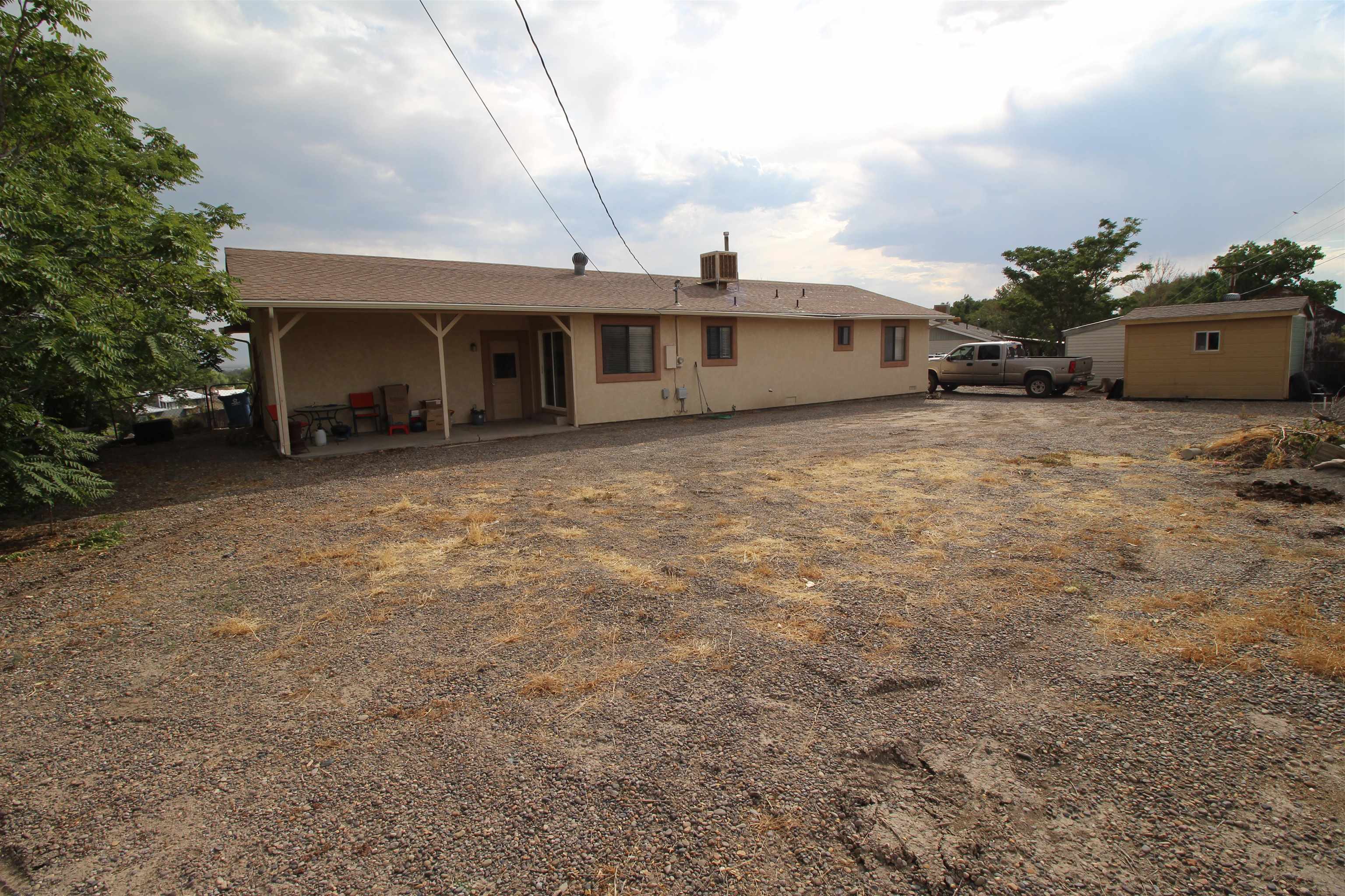 644 Highview Road Clifton, CO 81520 - Photo 14 of 14 a view of a house with a yard