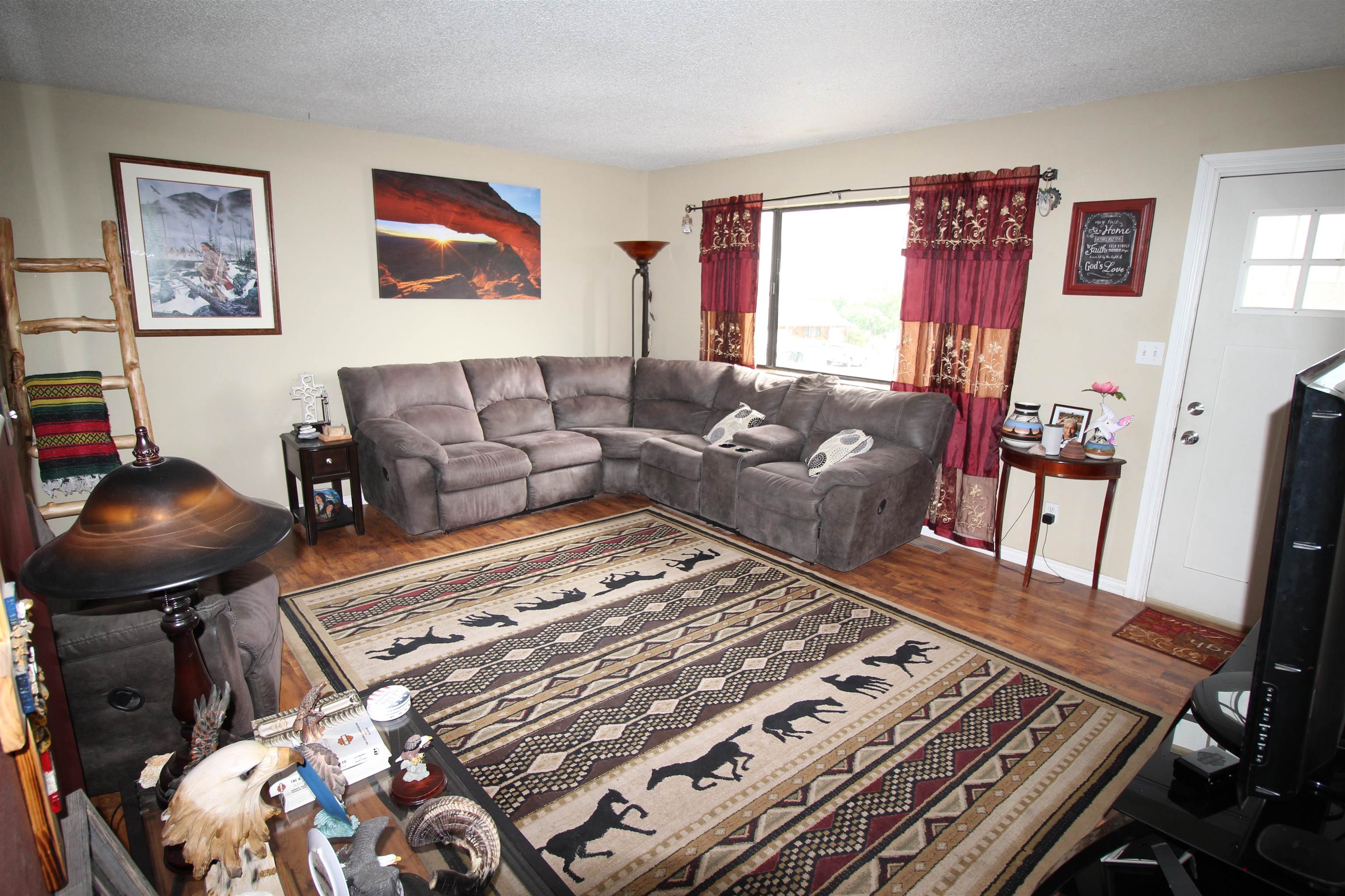 644 Highview Road Clifton, CO 81520 - Photo 3 of 14 a living room with furniture and a rug