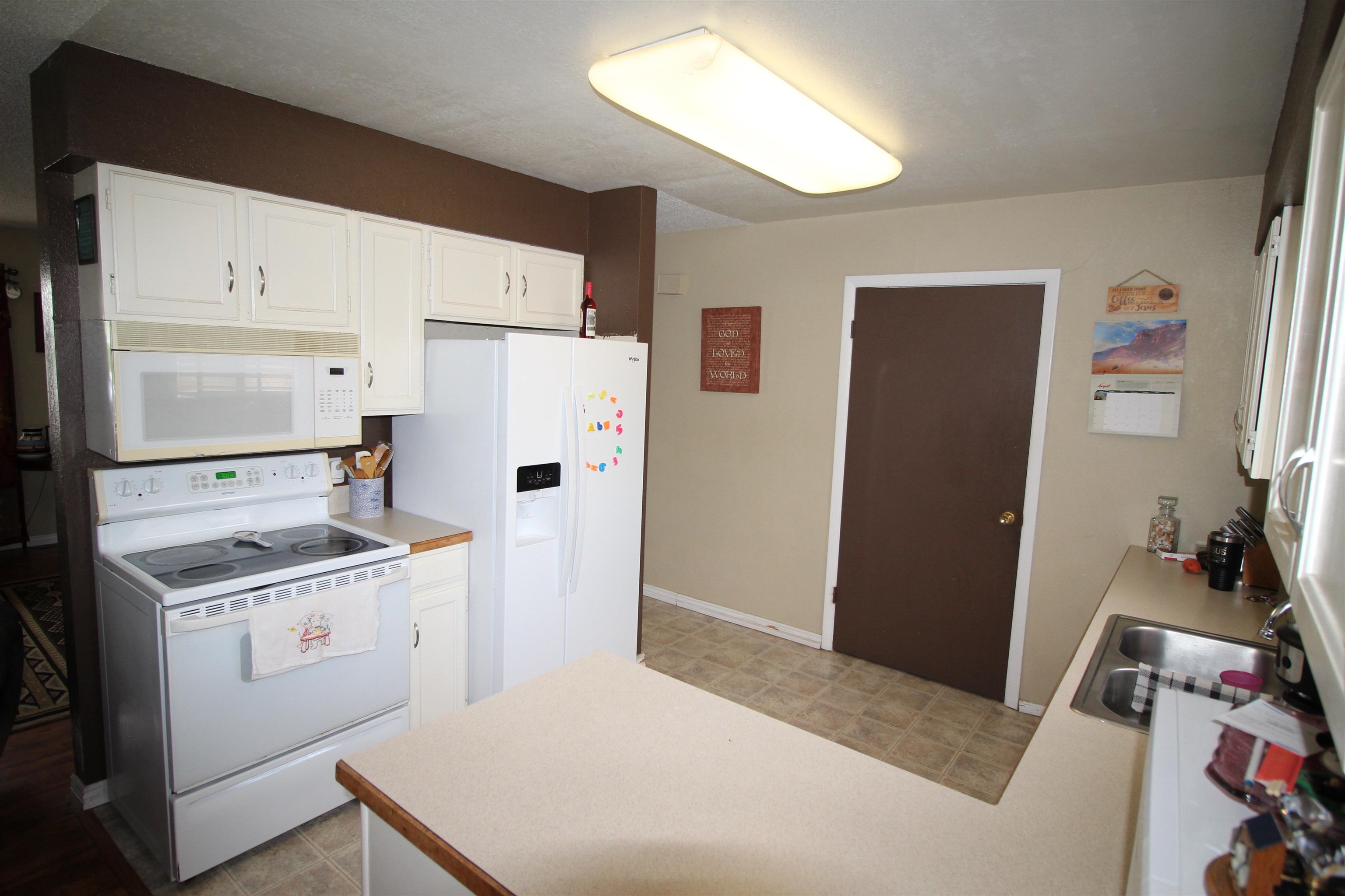 644 Highview Road Clifton, CO 81520 - Photo 6 of 14 a kitchen with a sink stove and refrigerator
