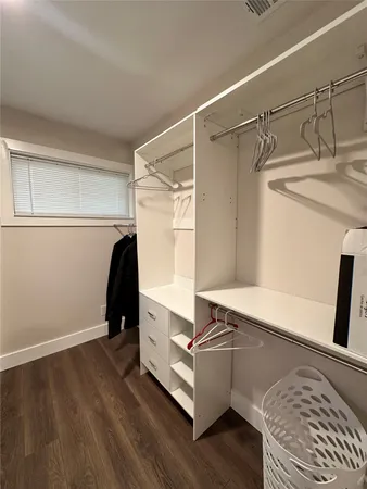 a room with a bed and a window