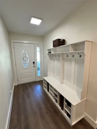 a room with furniture and wooden floor