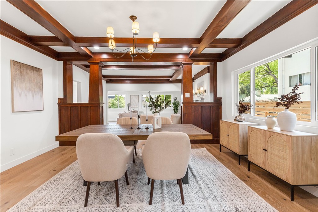 109 Painter Street Pasadena, CA 91103 - Photo 15 of 30 a view of a dining room with furniture a chandelier and wooden floor