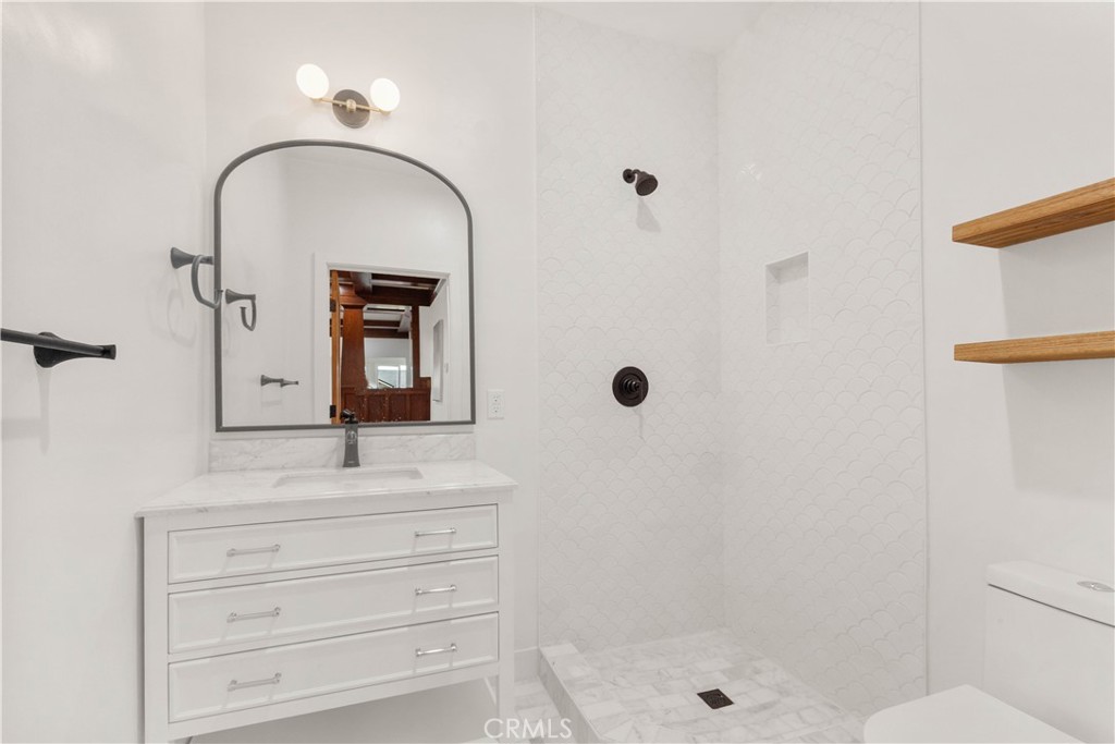 109 Painter Street Pasadena, CA 91103 - Photo 17 of 30 a bathroom with a sink a toilet and shower