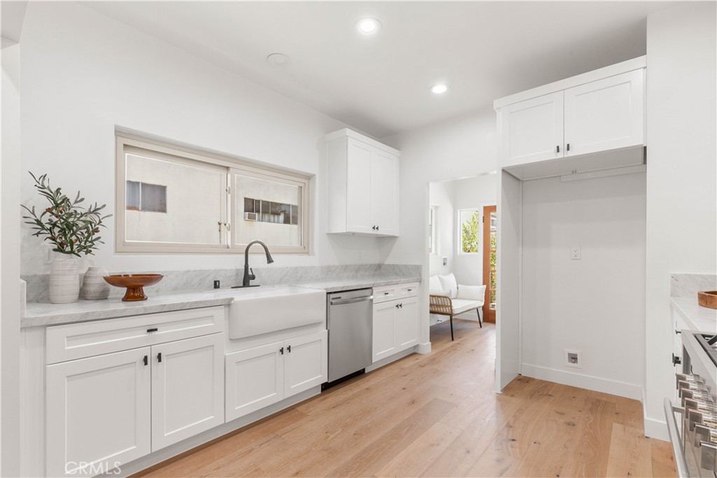 109 Painter Street Pasadena, CA 91103 - Photo 18 of 30 a spacious bathroom with a double vanity sink and mirror