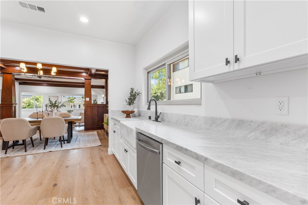 109 Painter Street Pasadena, CA 91103 - Photo 21 of 30 a large kitchen with stainless steel appliances a lot of counter space and a window