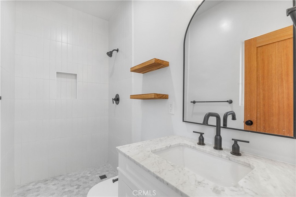 109 Painter Street Pasadena, CA 91103 - Photo 23 of 30 a bathroom with a sink vanity and mirror