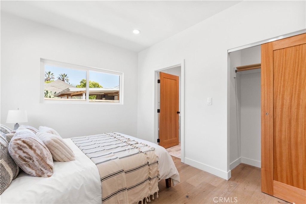 109 Painter Street Pasadena, CA 91103 - Photo 27 of 30 a bedroom with a bed and a window