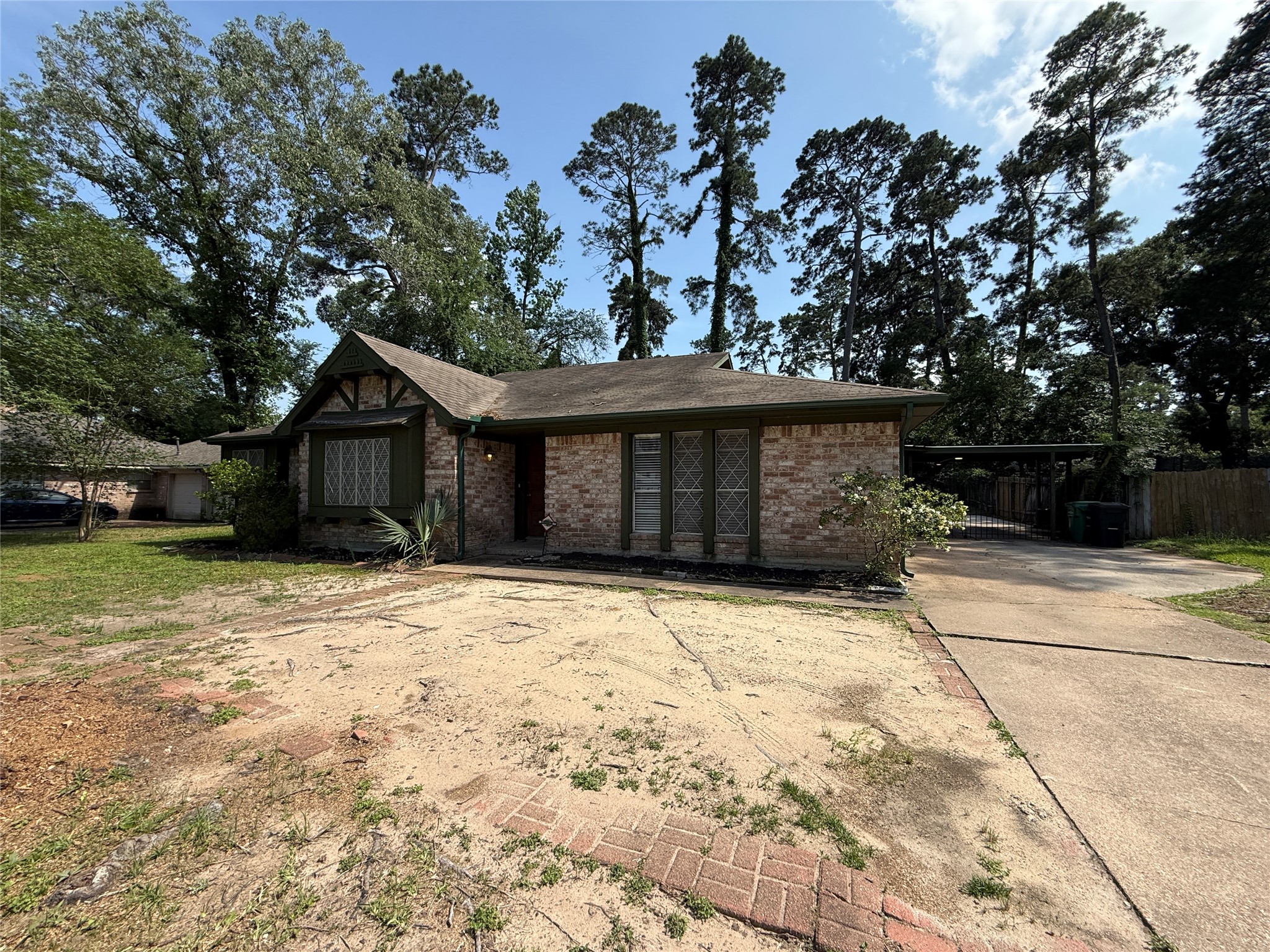 422 Gamewood Drive Spring, TX 77386 - Photo 3 of 25 a front view of a house with a yard and garage