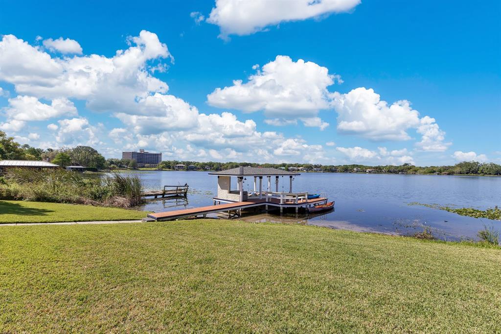 673 Balmoral Road Winter Park, FL 32789 - Photo 1 of 1 a view of a lake with houses in the back