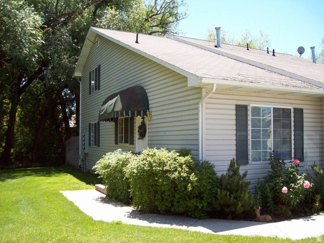 190 West 700 North Logan, UT 84321 - Photo 39 of 51 View of side of home with a yard
