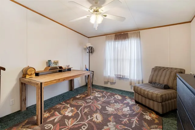 a living room with a couch and a chandelier
