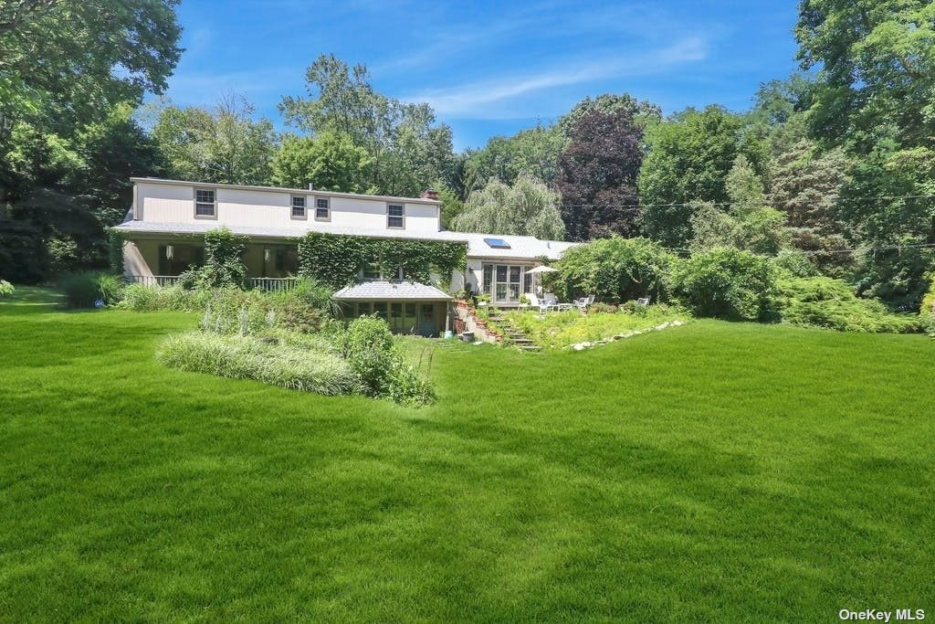 a view of a garden with a building in the background