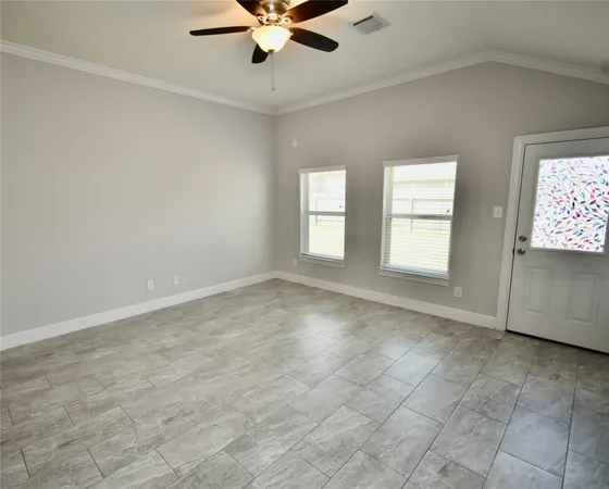 a view of an empty room with a window