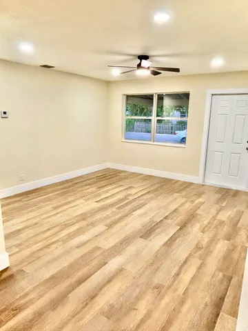 a view of an empty room with a window
