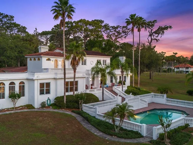 a front view of a house with a garden and a yard
