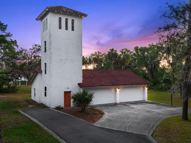 a work room with furniture and a mirror