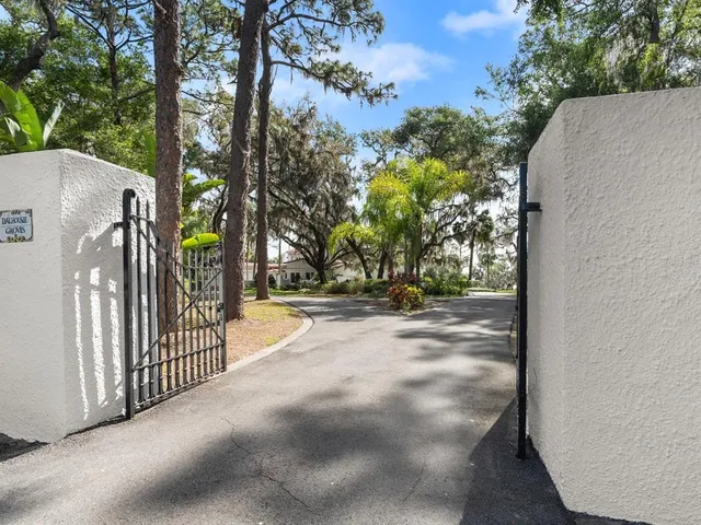 a living room with furniture a window and a dining table