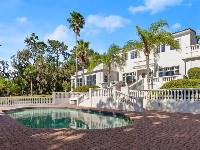 a view of a lake with houses in the back