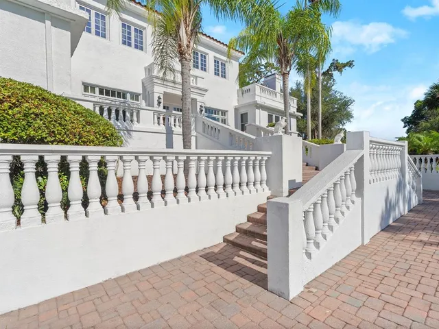 a bathroom with a bathtub sink and mirror