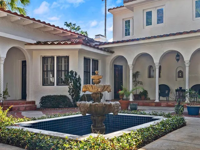 a bedroom with a bed couch and window