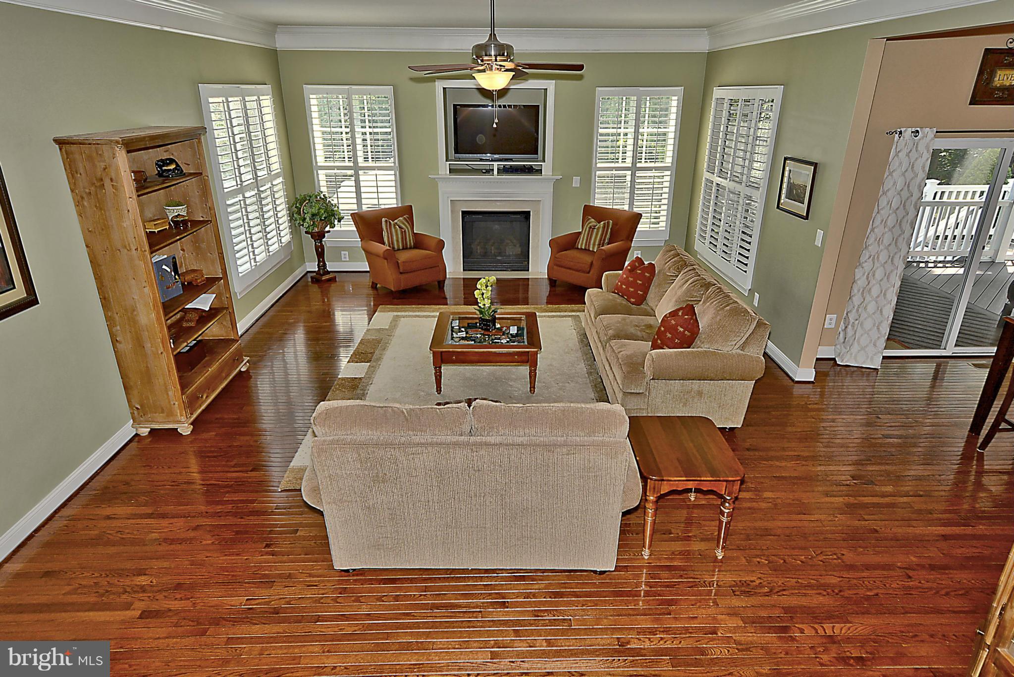9062 Roaring Spring Loop Bristow, VA 20136 - Photo 6 of 30 Room for all by the fire in this family room!