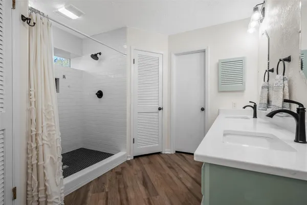 a bathroom with a sink and a shower