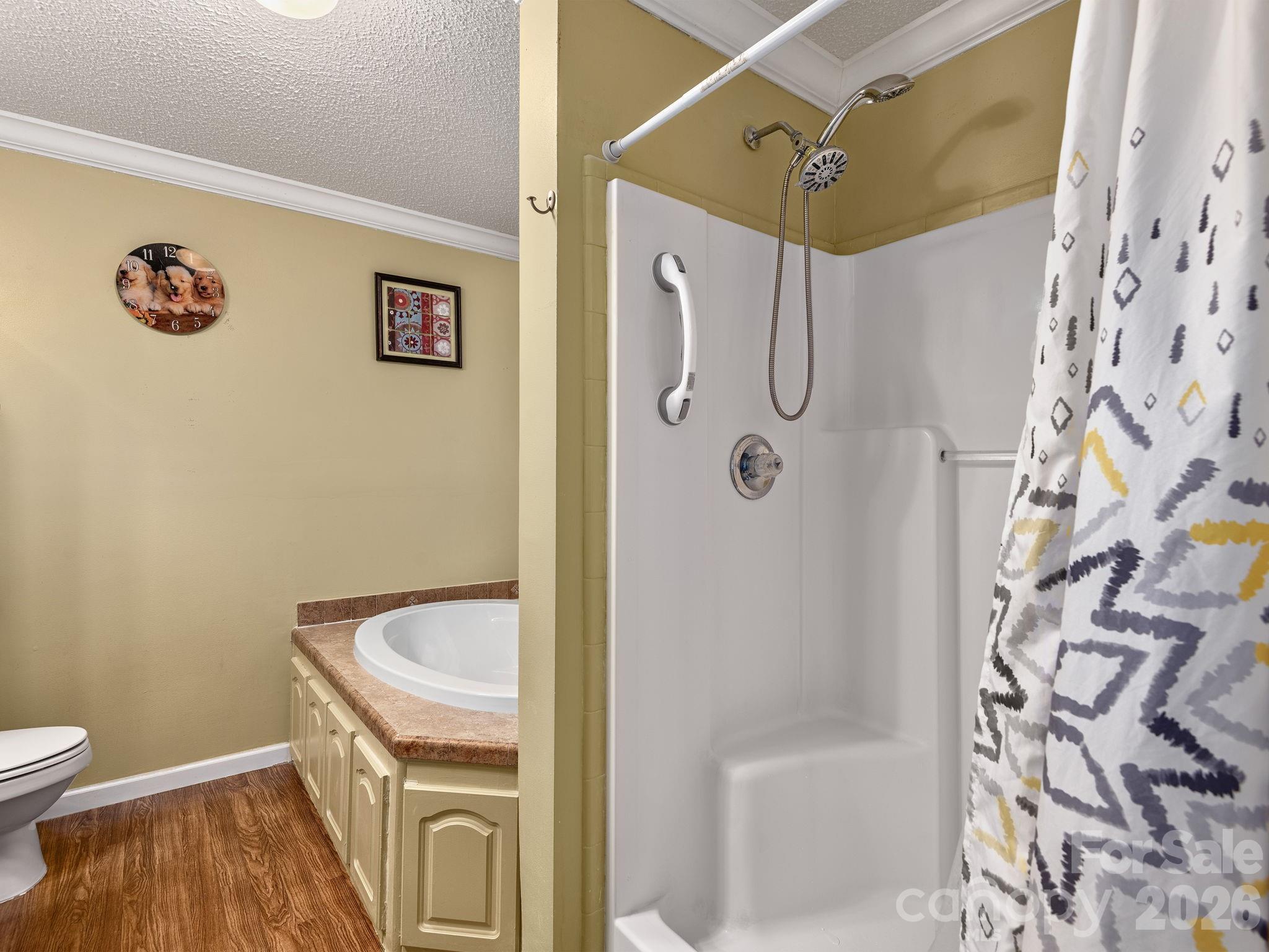 373 Starnes Cove Road Candler, NC 28715 - Photo 11 of 21 a bathroom with a granite countertop shower and a sink