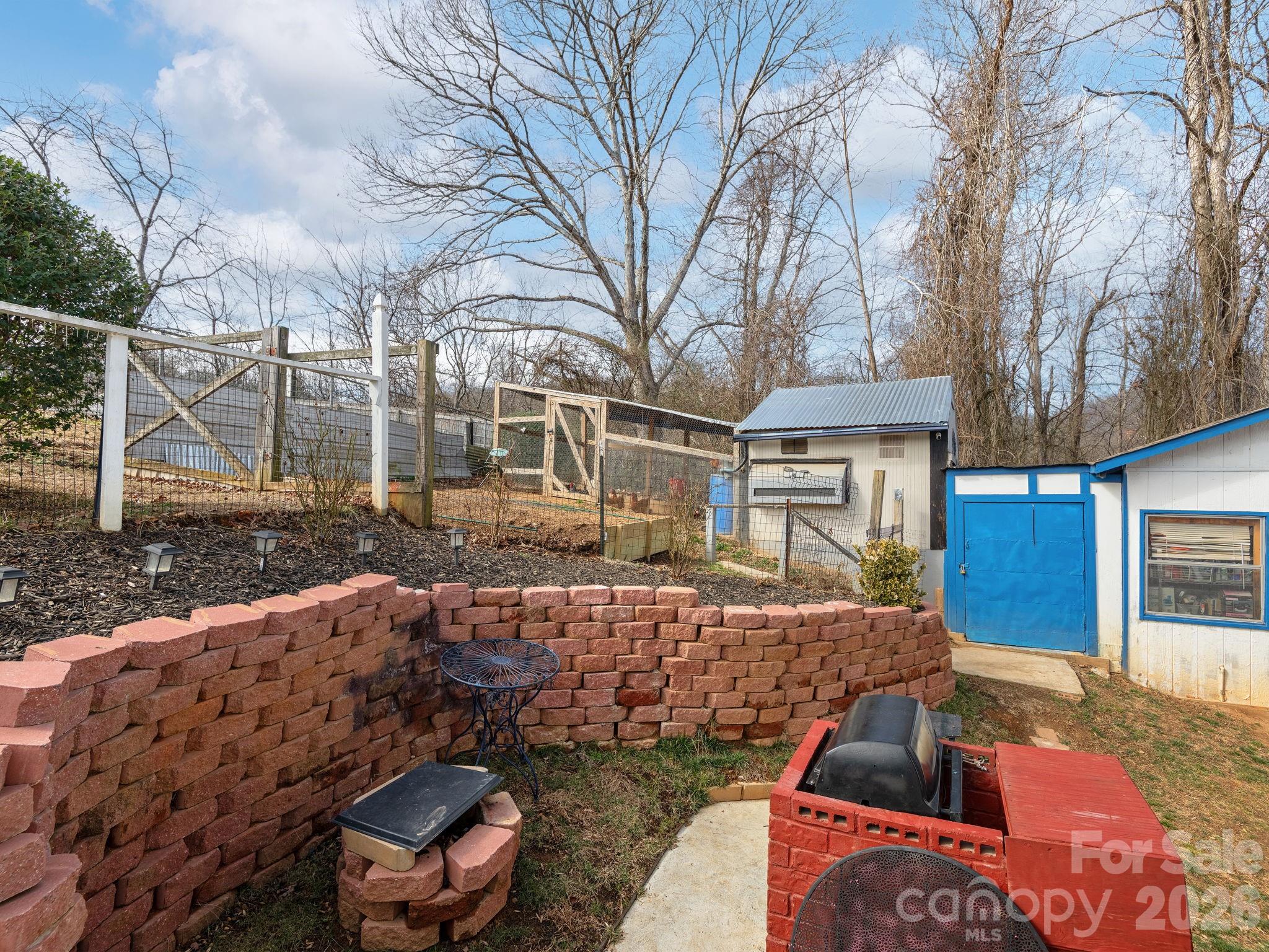 373 Starnes Cove Road Candler, NC 28715 - Photo 16 of 21 a view of a house with backyard