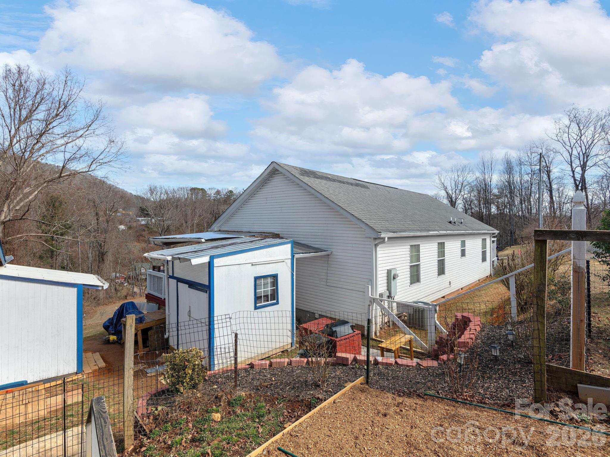 373 Starnes Cove Road Candler, NC 28715 - Photo 18 of 21 a view of house with a outdoor space