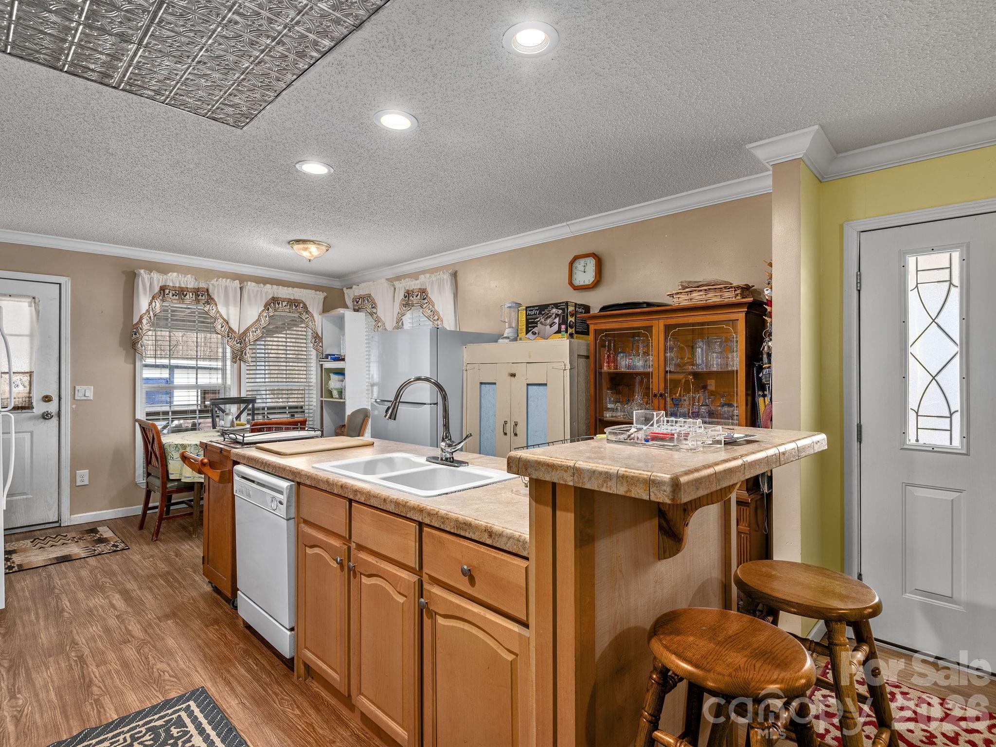 373 Starnes Cove Road Candler, NC 28715 - Photo 4 of 21 a kitchen with a stove and a refrigerator