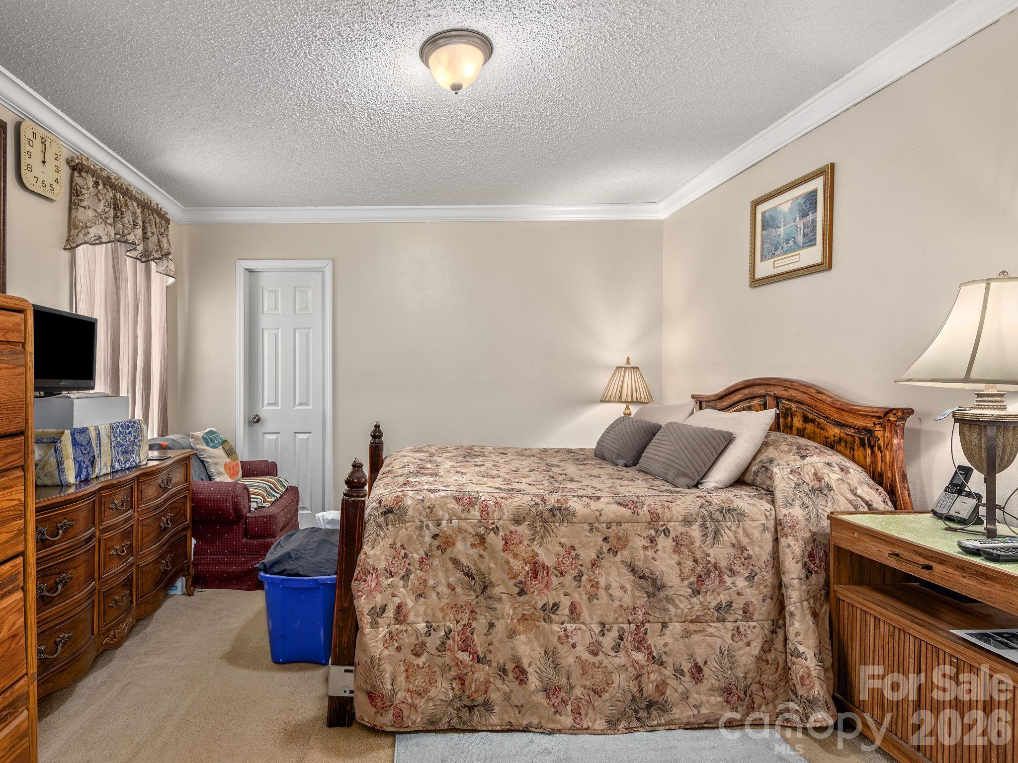 373 Starnes Cove Road Candler, NC 28715 - Photo 8 of 21 a bedroom with a bed and furniture