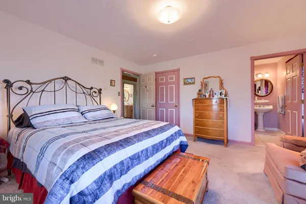 a bedroom with a bed and a closet